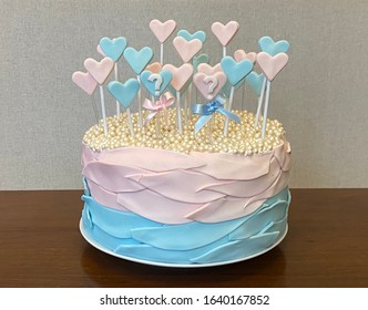 Baby Gender Revelation Cake With Pastel Colors And Little Hearts