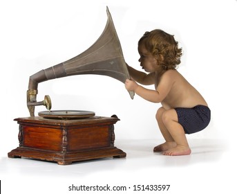 Baby get curious by an old gramophone
