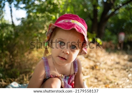 beautiful baby looking very funny into the the camera