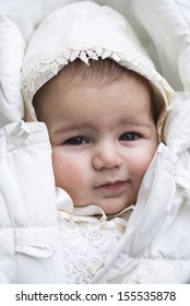 Baby girl bundled up in winter coat