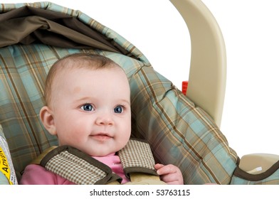 A Baby Girl In A Carseat On A White Background.