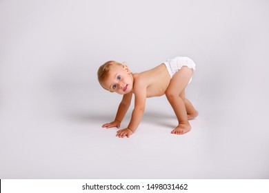 baby girl in diaper on white background