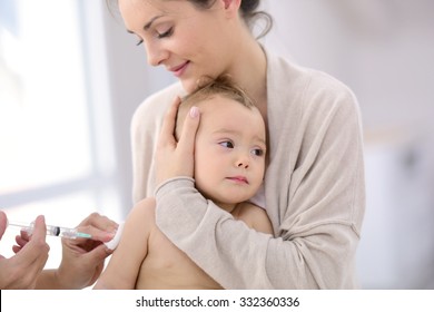 Baby Girl At Doctor's Office Receiving Vaccine Injection