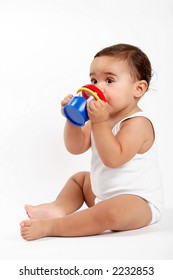 baby girl drinking water herself