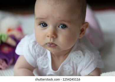 Baby Girl Drooling While Lying On Her Tummy