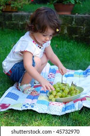 Baby Girl Eating Green Grapes On A Pic-nic