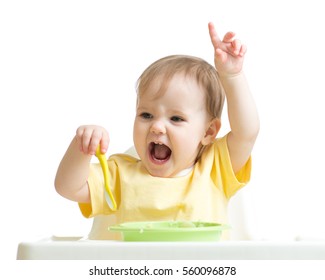 Baby Girl Eating Her Dinner Isolated On White Background