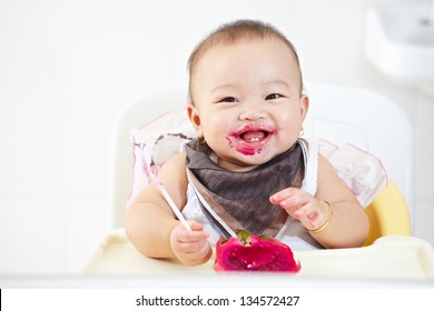 Baby Girl Eating Red Dragon Fruit