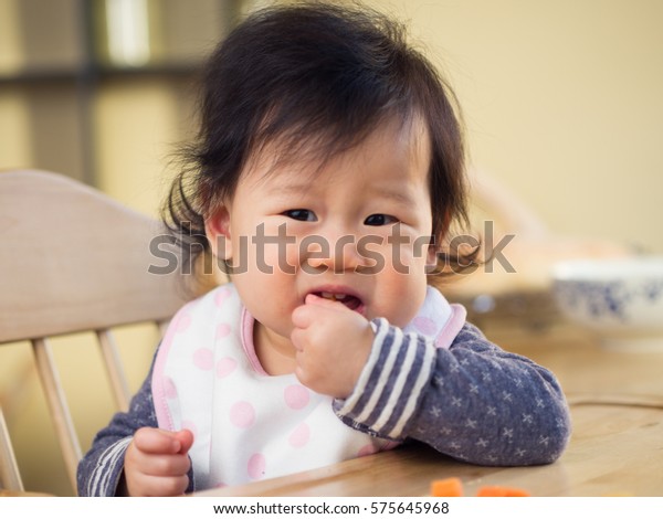 Baby Girl Eating Vegetable First Time Stock Photo (Edit Now) 575645968