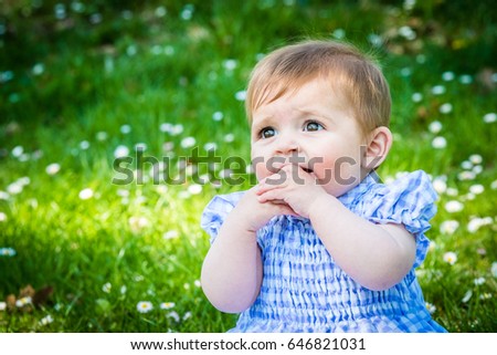 Similar – Six months old baby girl outdoors