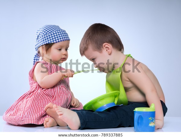feeding boy with girl