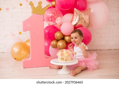 Baby Girl  At First Birthday With Smash Cake