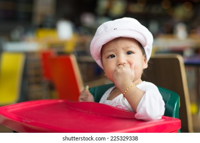 Baby Girl Have Lunch At Fast Food Restaurant