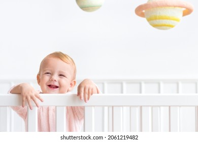Baby girl in her crib