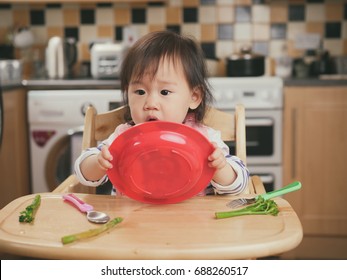 Baby Girl Hold Plate And Throw The Food Away