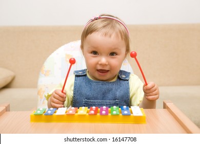 Baby Girl With Instrument