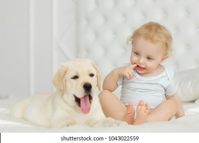 Baby Girl With Labrador Puppy