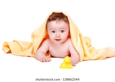 Baby Girl Lying Under The Yellow Towel On White Background