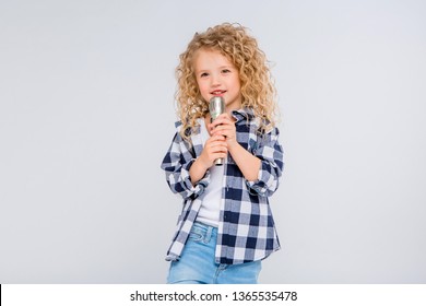 Baby Girl With Microphone Smiling Singing,Fat Girl Singing Song Into Microphone. Young Star, Looking For Talents.