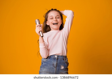 Baby Girl With Microphone Smiling Singing,Fat Girl Singing Song Into Microphone. Young Star, Looking For Talents.