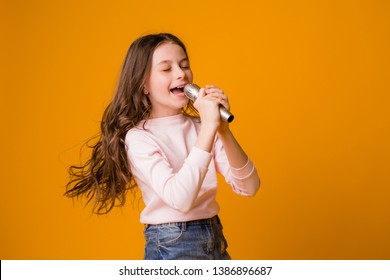 Baby Girl With Microphone Smiling Singing,Fat Girl Singing Song Into Microphone. Young Star, Looking For Talents.