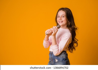 Baby Girl With Microphone Smiling Singing,Fat Girl Singing Song Into Microphone. Young Star, Looking For Talents.