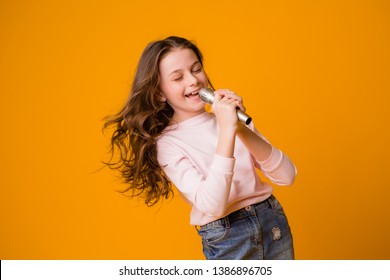 Baby Girl With Microphone Smiling Singing,Fat Girl Singing Song Into Microphone. Young Star, Looking For Talents.