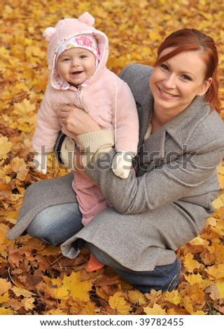  Baby girl with mother play in park