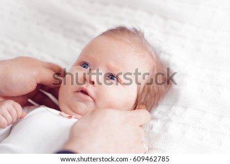 Baby taking feeding bottle