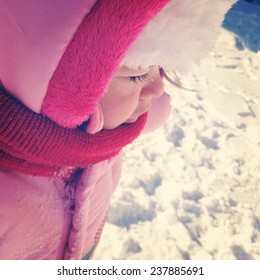 Baby girl outside in snow - Instagram effect - Shutterstock ID 237885691