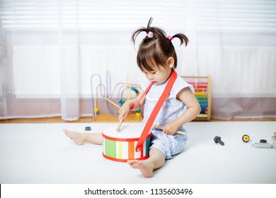 Baby Girl Play Drum At Home