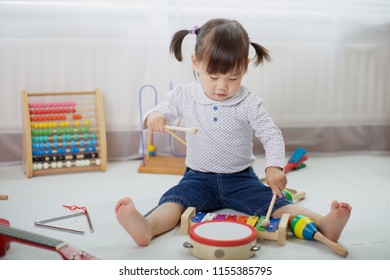 Baby Girl Play Drum At Home