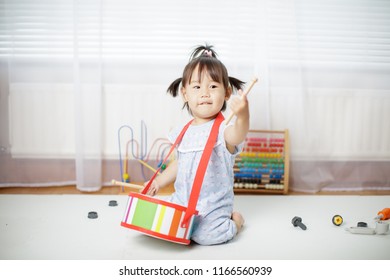 Baby Girl Play Drum At Home