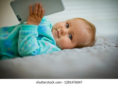 Baby Girl Playing With A Cell Phone.