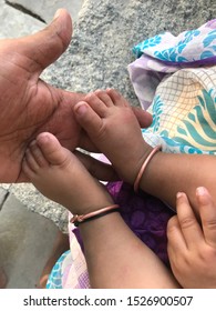 Baby Girl Playing In Grand Ma Hand 