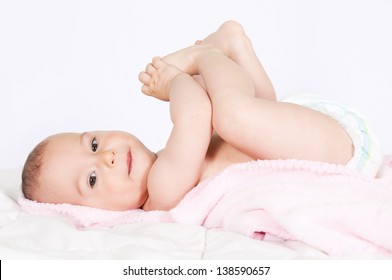 Baby Girl Playing With Her Feet