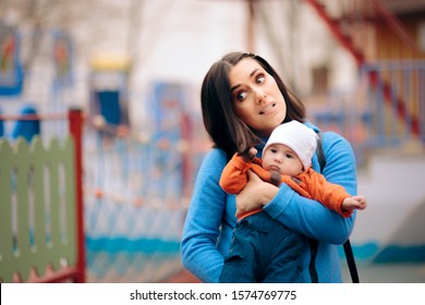 Baby Girl Playing With Mom Pulling Her Hair. Naughty Daughter Acting Out In The Park
