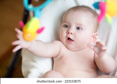 Baby Girl Pulling Hand To Toy