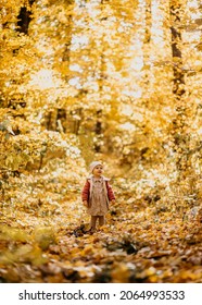 Baby Girl Running Happy Towards Camera In A Park Autumn