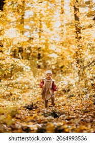 Baby Girl Running Happy Towards Camera In A Park Autumn