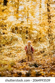 Baby Girl Running Happy Towards Camera In A Park Autumn