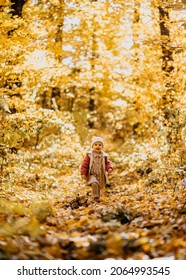 Baby Girl Running Happy Towards Camera In A Park Autumn