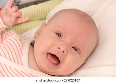 Baby Girl Showing Rock Sign