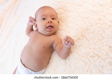 Baby Girl Shows Her Tongue And Smiles