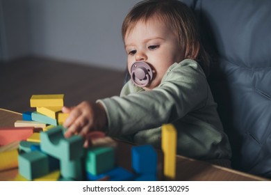 Happy Little Baby Girl Sitting On He Dads Stomach While Caring Young