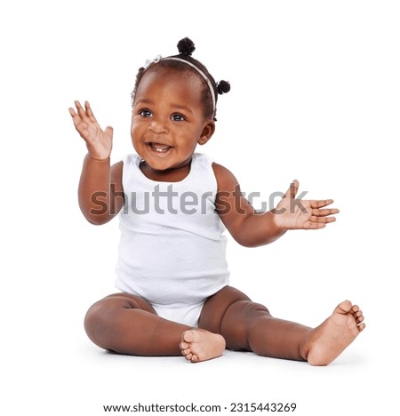 Baby, girl and smile with infant, excited and cheerful isolated against a white studio background. Female child, kid on the floor and adorable toddler with joy, relax and growth with newborn and care