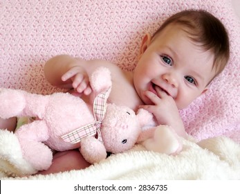 Baby Girl Smiling With Bunny Rabbit