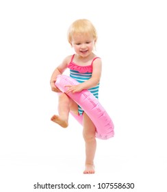 Baby Girl In Swimsuit Playing With Inflatable Ring