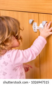 Baby Girl Trying To Open The Kitchen Cabinet – Baby Proofing The Door 