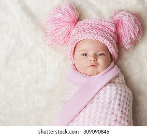 Baby Girl Wrapped Up In Newborn Blanket, New Born Kid Bundled Hat, One Month On Carpet